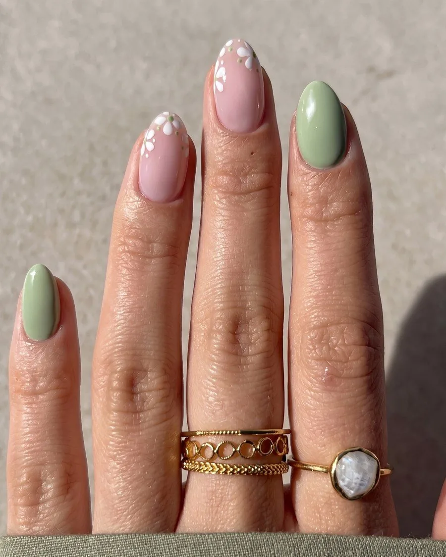 Natural length almond nails in sage green and soft pink, worn over the natural nail