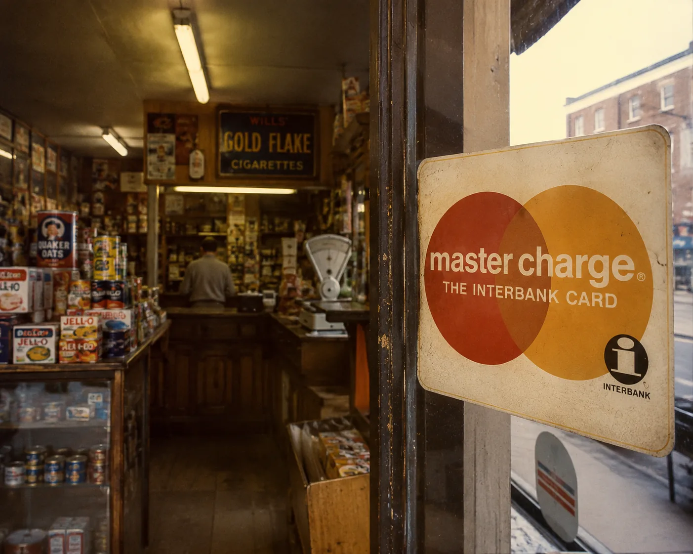 A Master Charge: The Interbank Card sign in a shop window