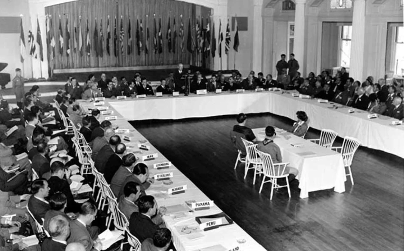 Delegates from 44 Allied nations seated at long tables during the Bretton Woods conference, 1944