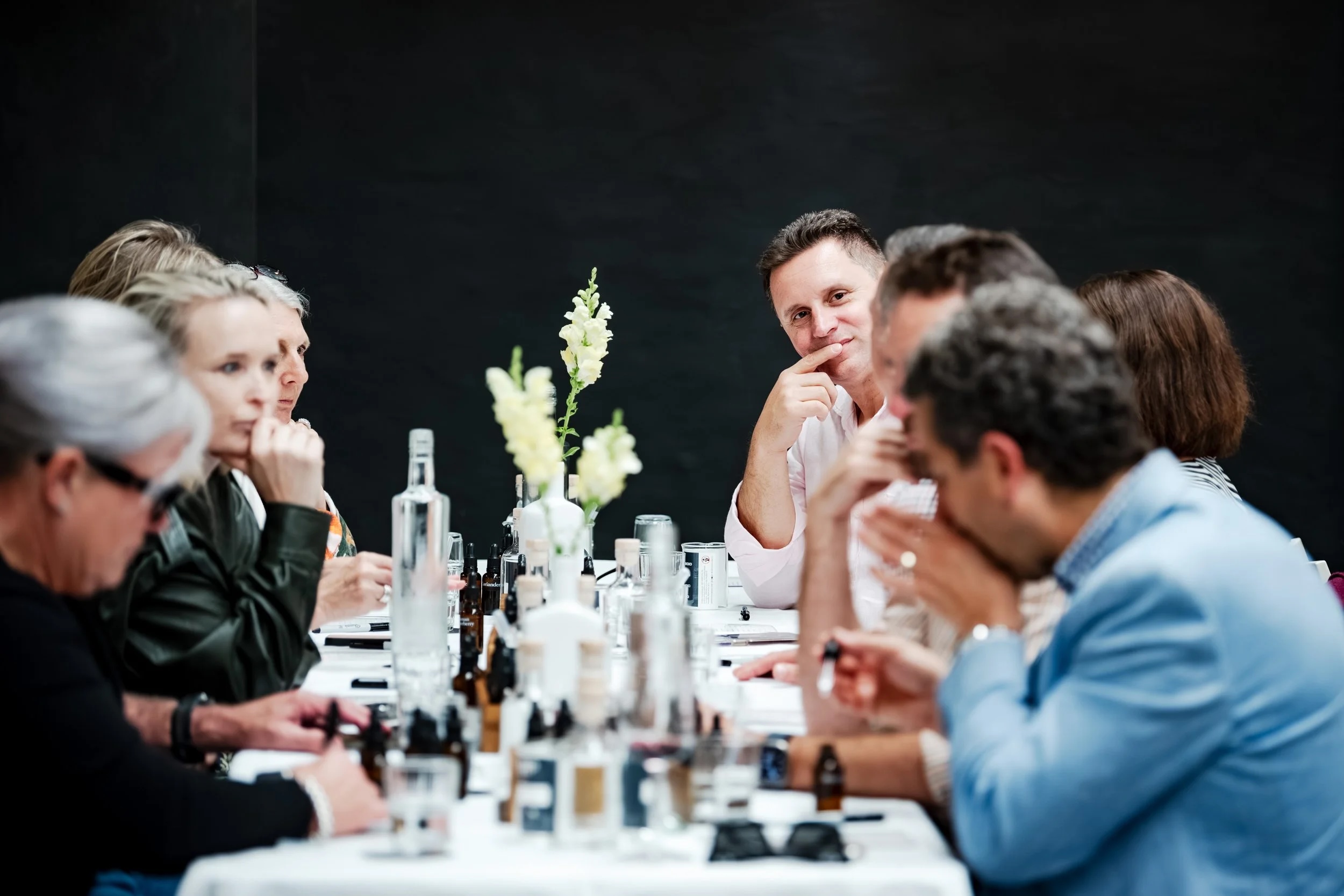 People talking around a table at a networking dinner