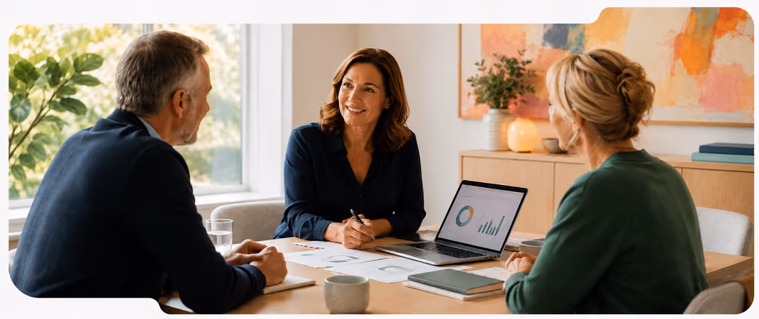 Three colleagues discussing association operations at a meeting table