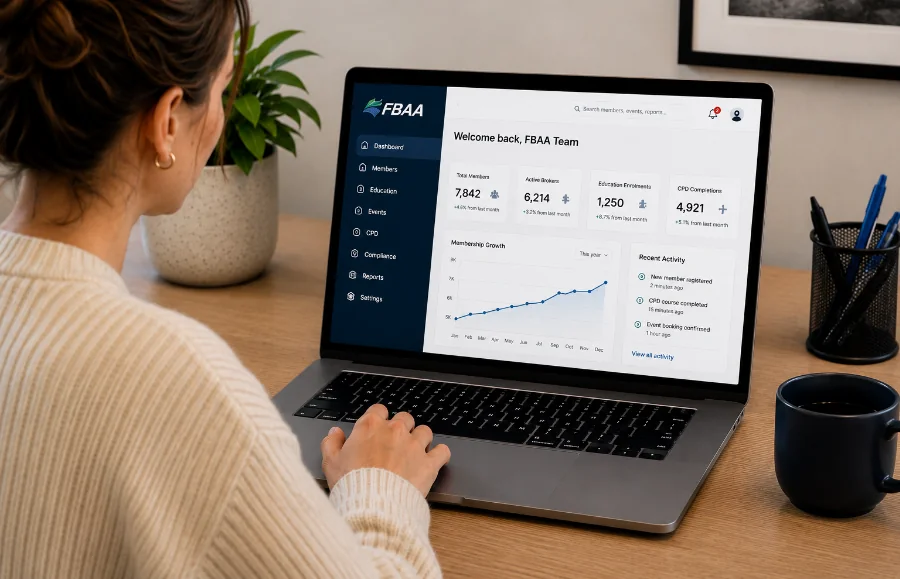 Person using a laptop displaying a FBAA financial dashboard