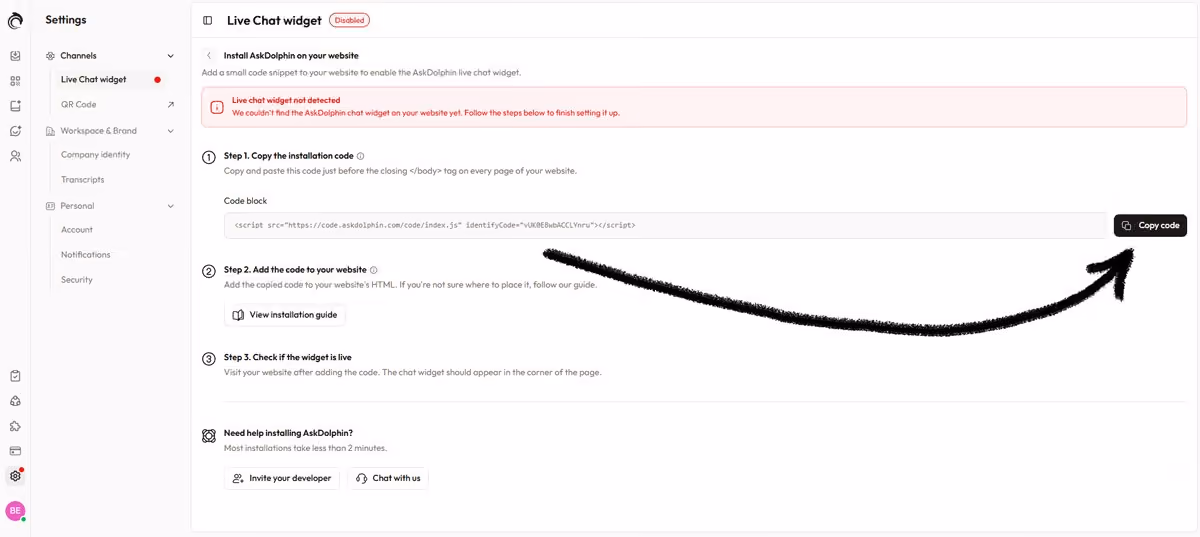 AskDolphin Install AskDolphin on your website page showing the installation code in the Code block, with an arrow pointing to the Copy code button.