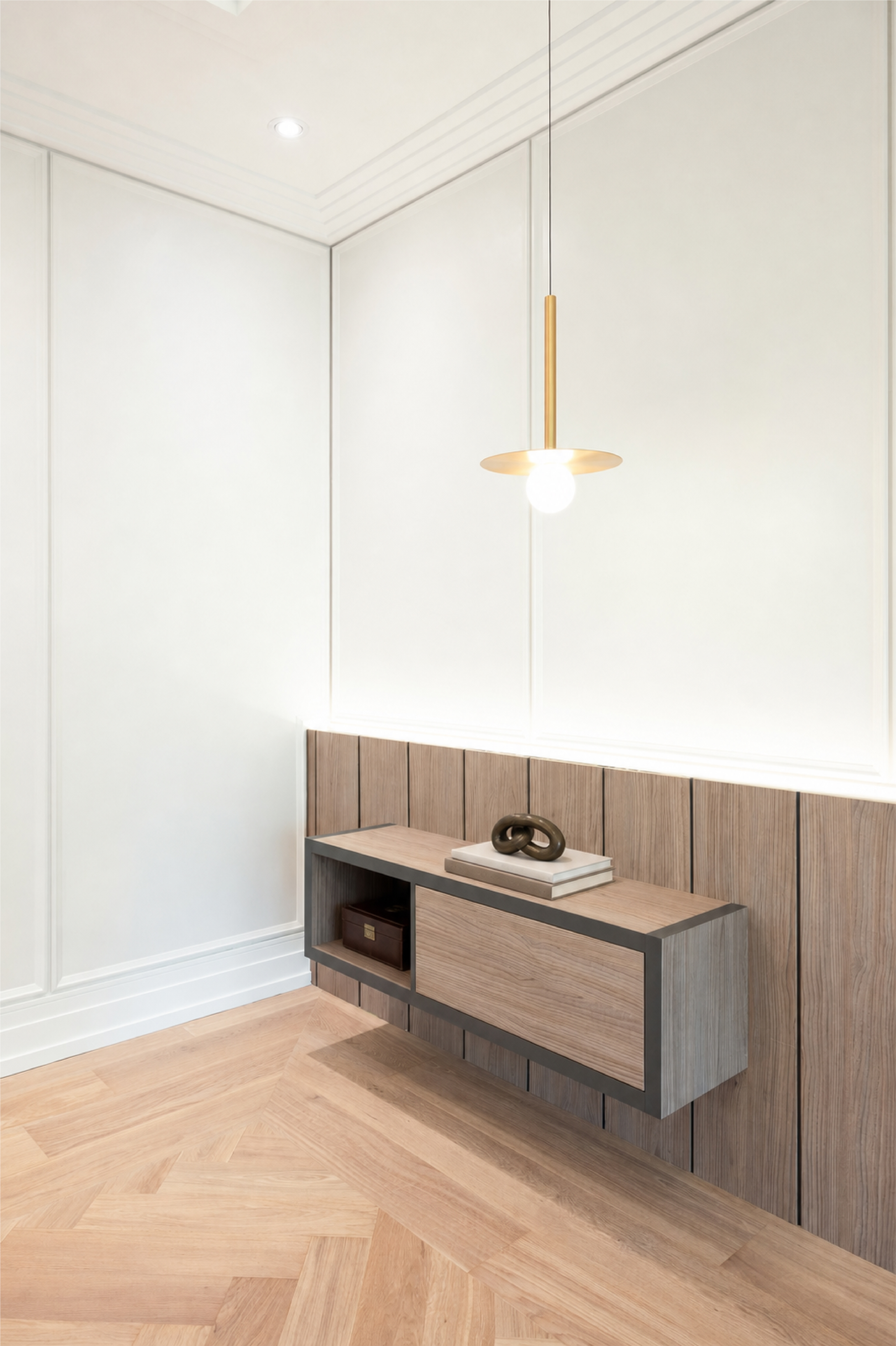 Close-up of floating wood bedroom console against white panelled walls