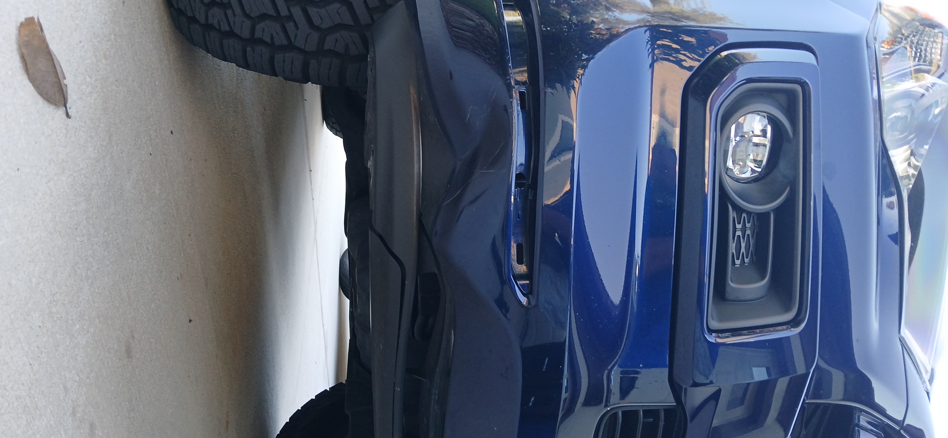 front bumper corner before repair in Wesley Chapel