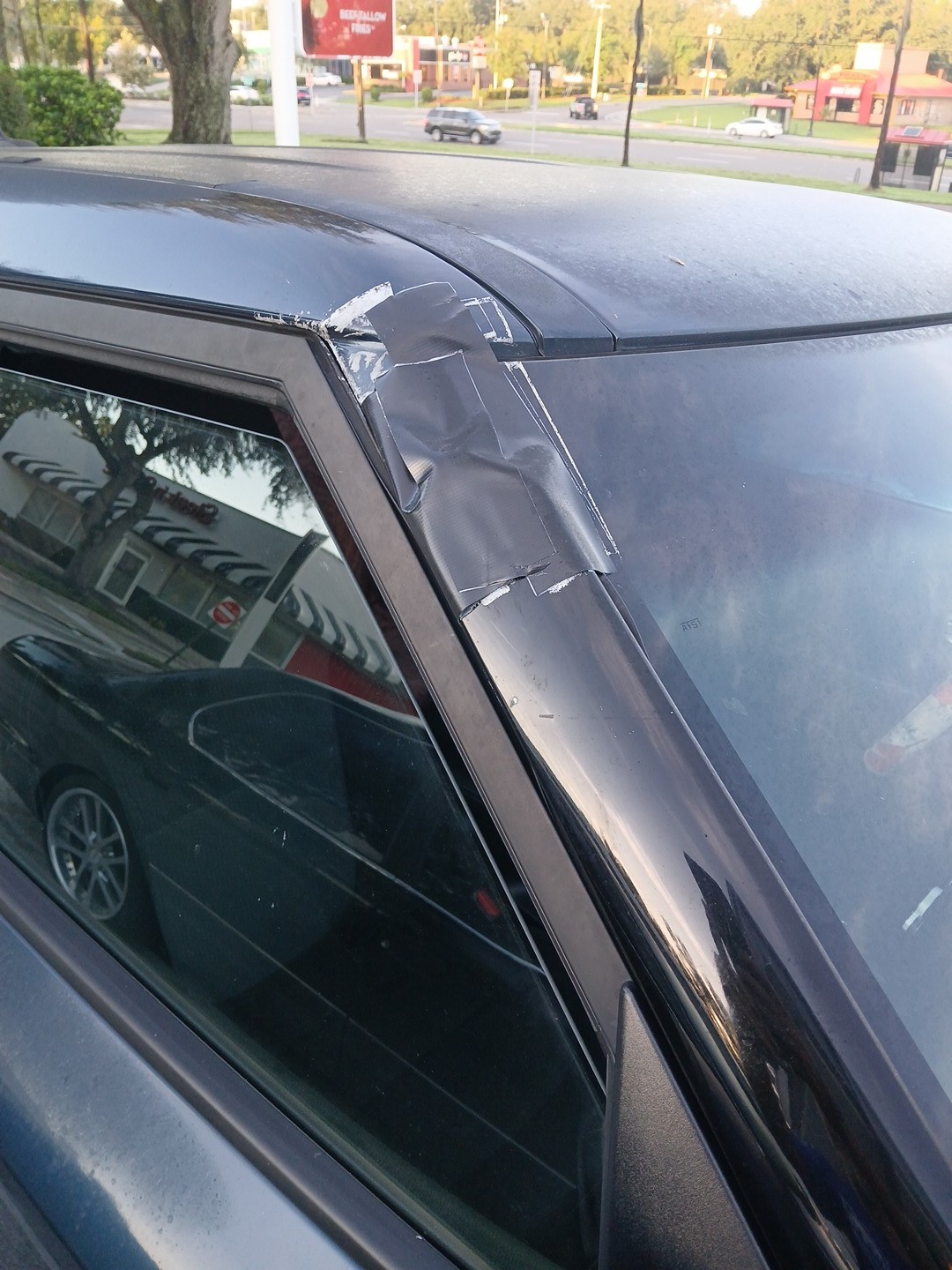 passenger A-pillar trim before repair in Lakeland