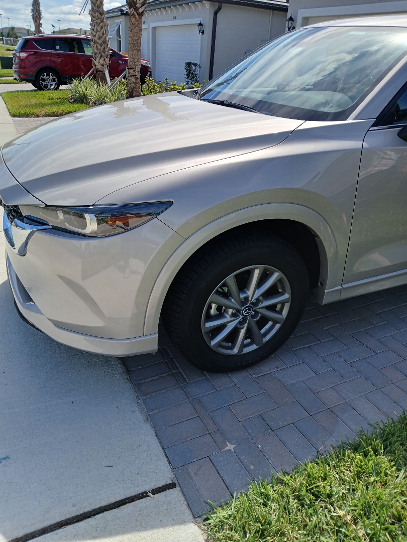 Mazda CX-5 front bumper, driver-side fender and fender flare after mobile repair in San Antonio, Florida.