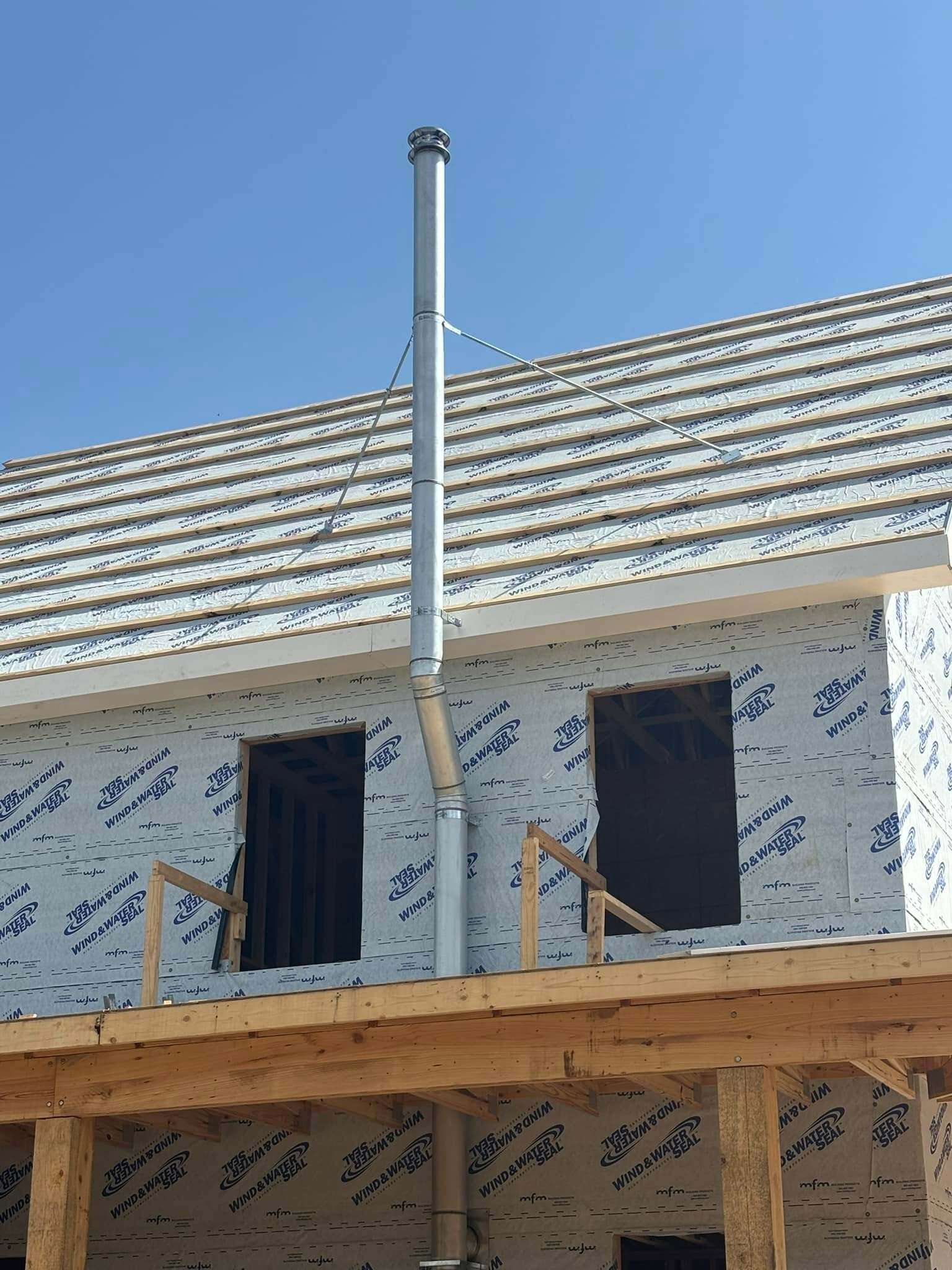 Chimney flue installation on a new-construction home