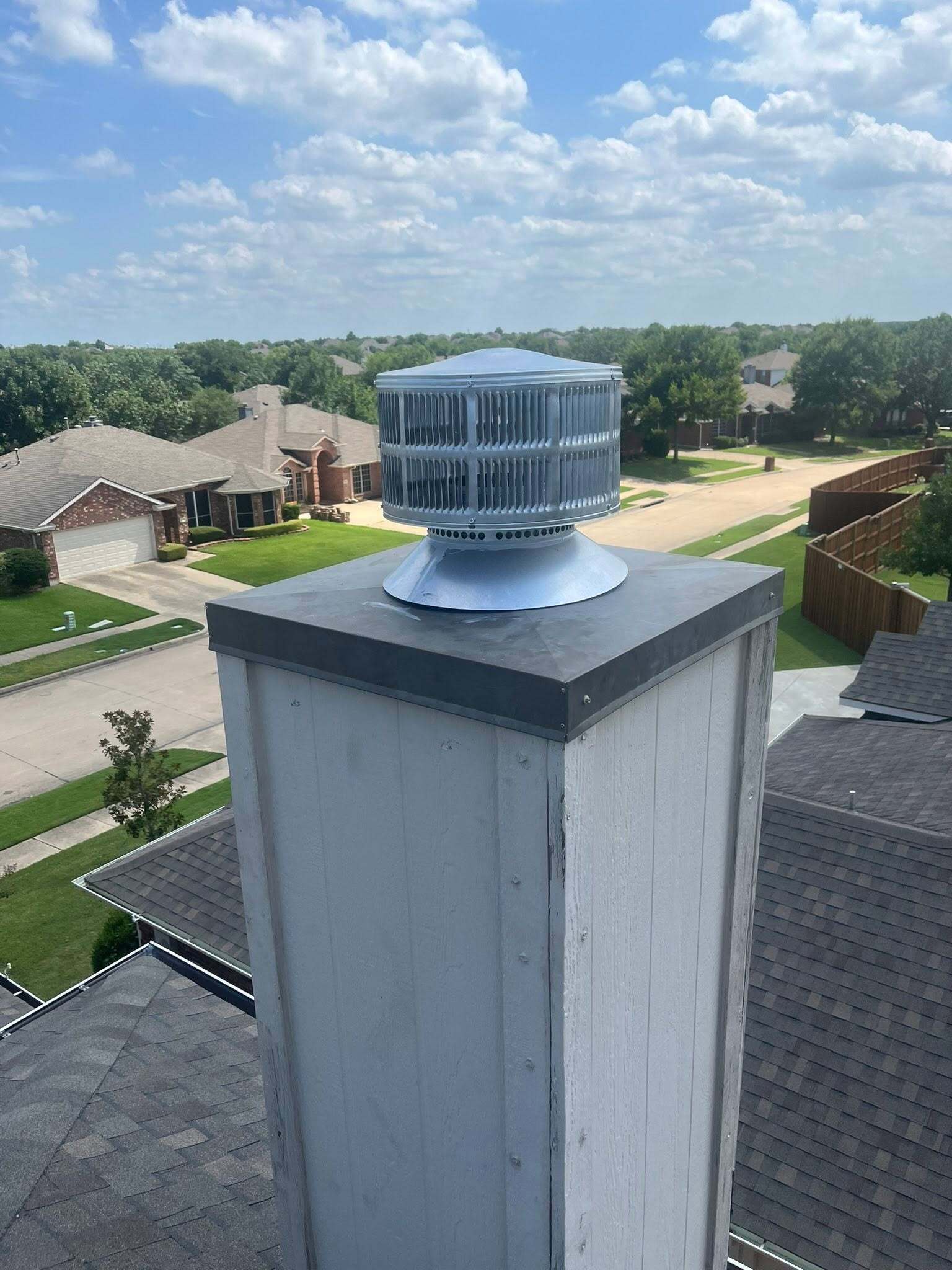 Chimney cap installed on a residential roof