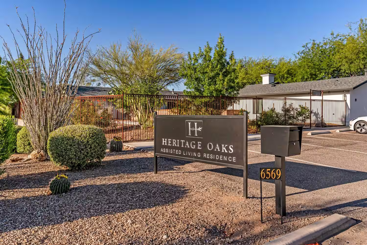 Heritage Oaks monument sign marked 6569 at the parking lot entrance on E Carondelet Drive