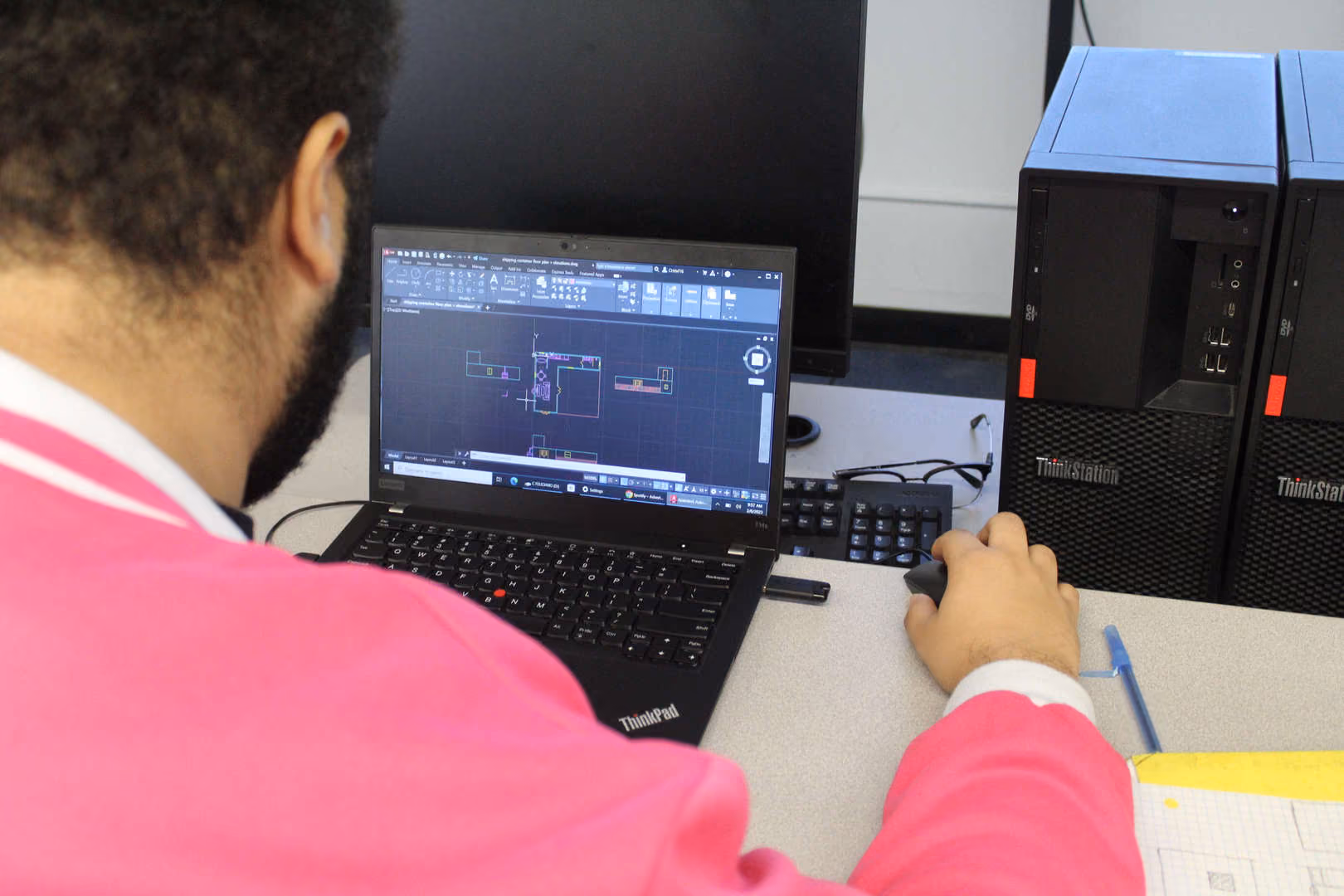 Student using CAD software on a ThinkPad laptop in class