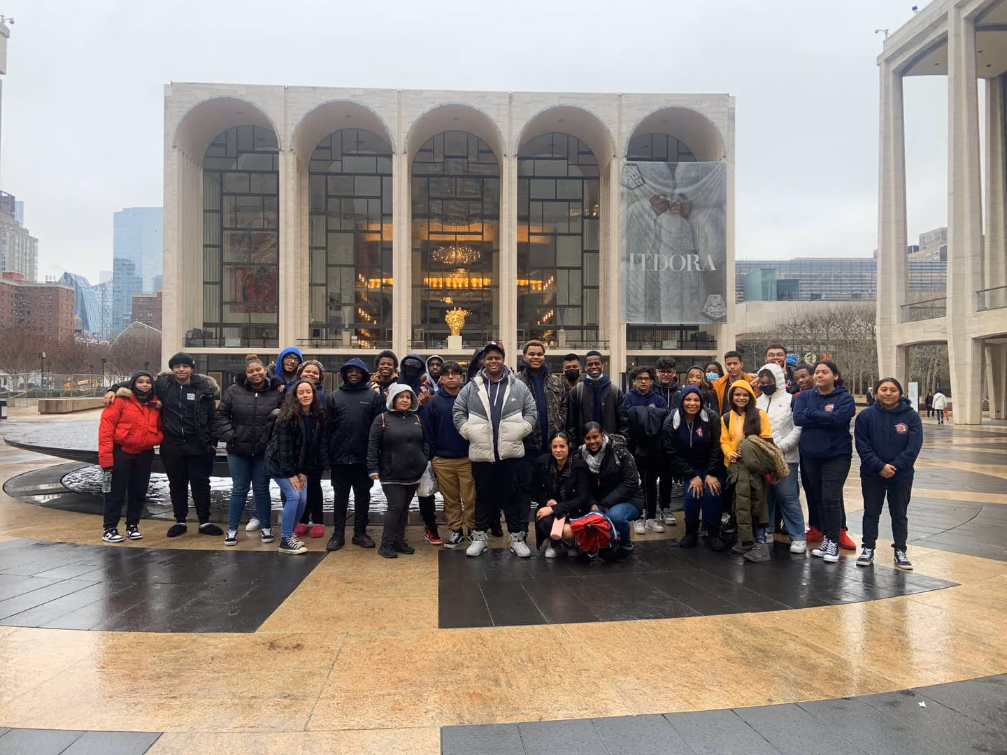 Students posing together outside Lincoln Center in New York City