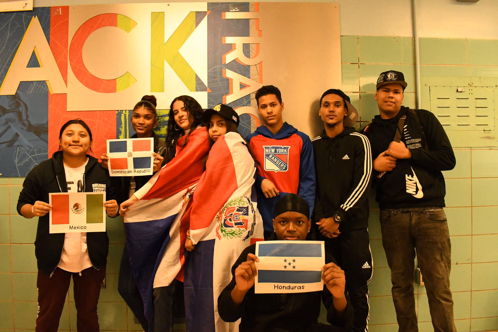 Students display flags representing Mexico Dominican Republic and Honduras