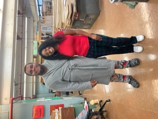 Two students posing together during Pajama Day celebration