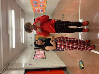 Two students posing together during Pajama Day celebration