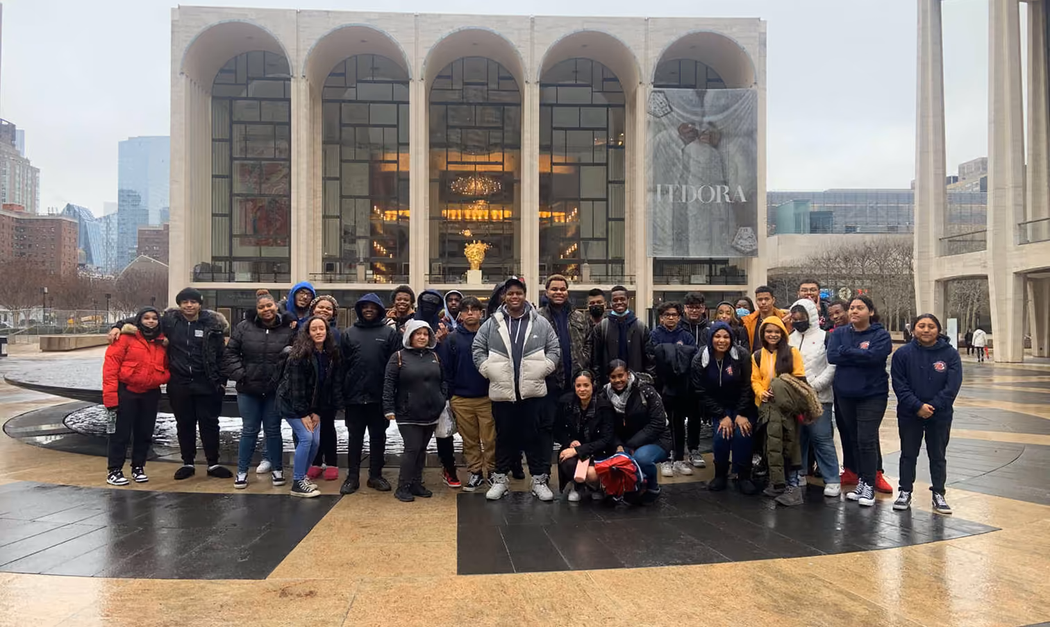 Students posing for group photo outside Lincoln Center New York