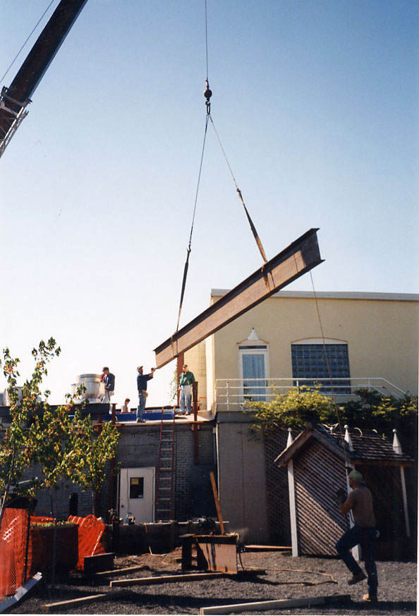 Steel beam being lifted by a crane