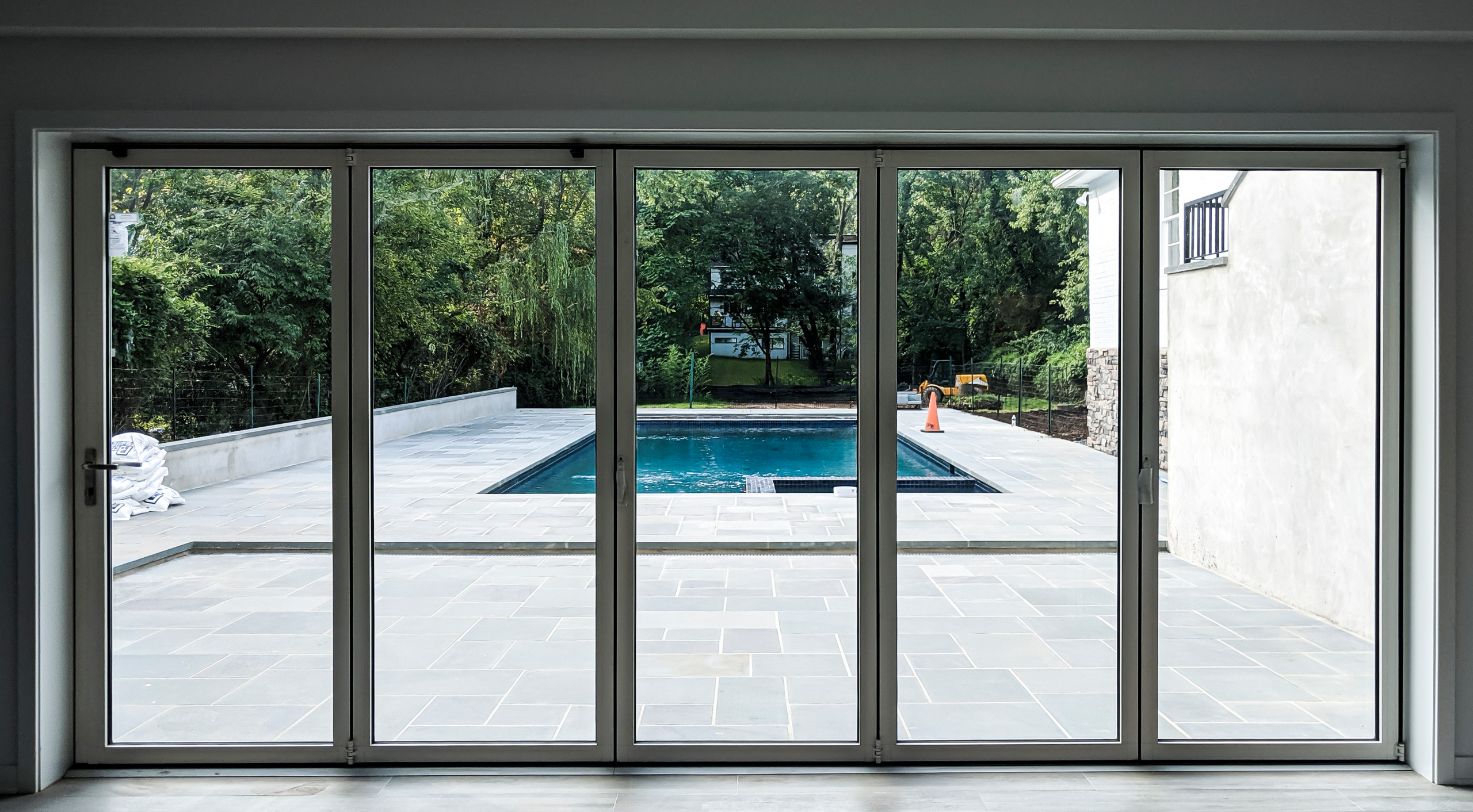 Interior window facing exterior backyard swimming pool
