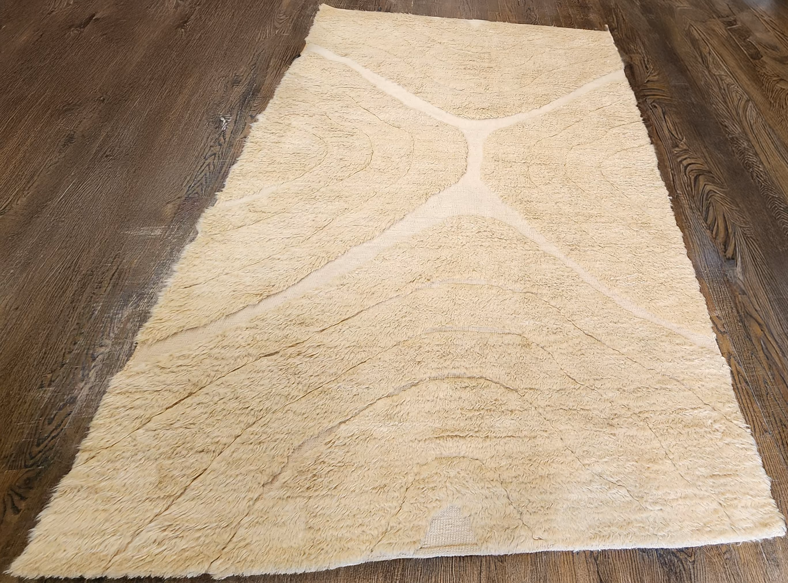 The rug before Rug Refinery's service, showing its original condition