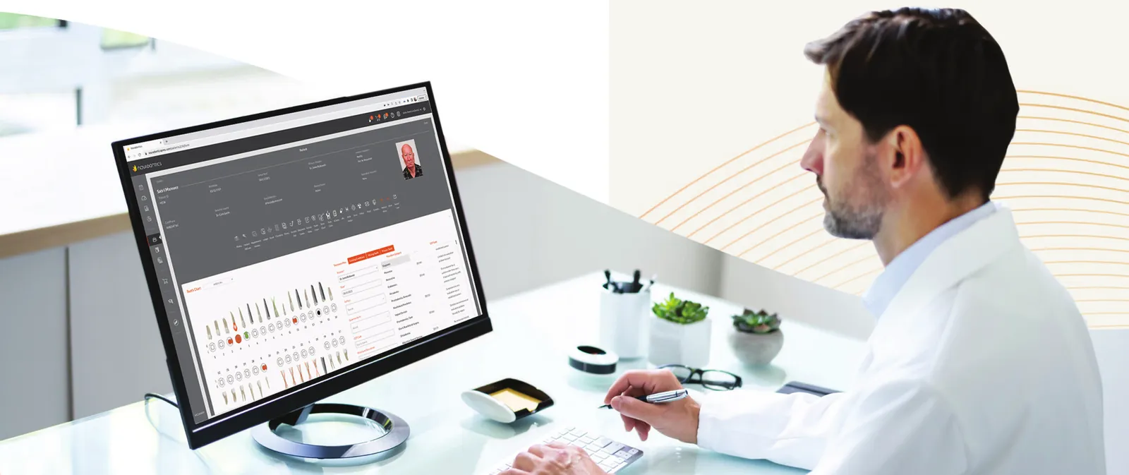 Dentist reviewing patient charts in Novadontics on a desktop monitor