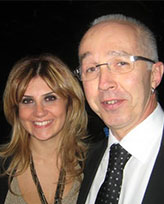 Two Marveltour colleagues smiling together at an evening event