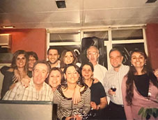 Archive group photo of the Marveltour team posing together indoors