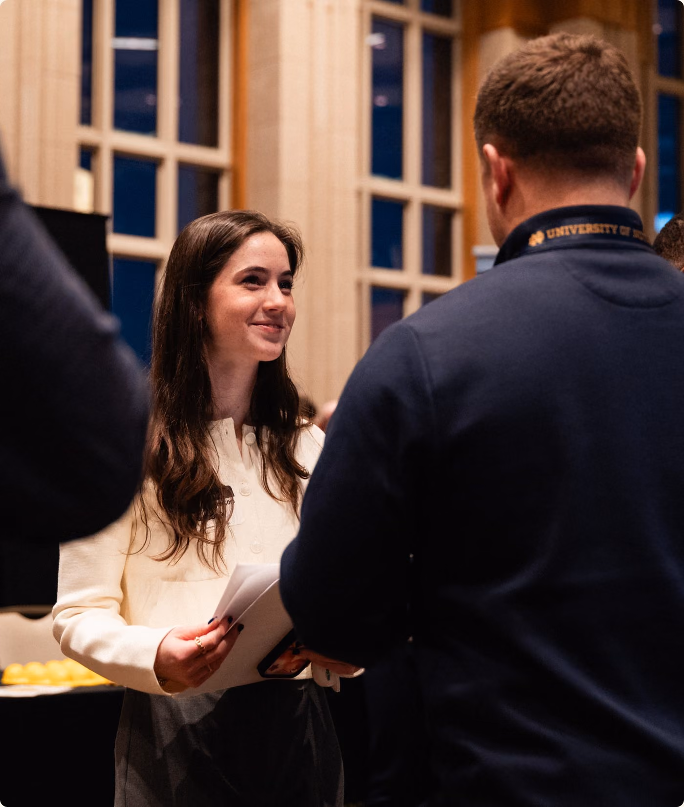 Encore team members in conversation at an event