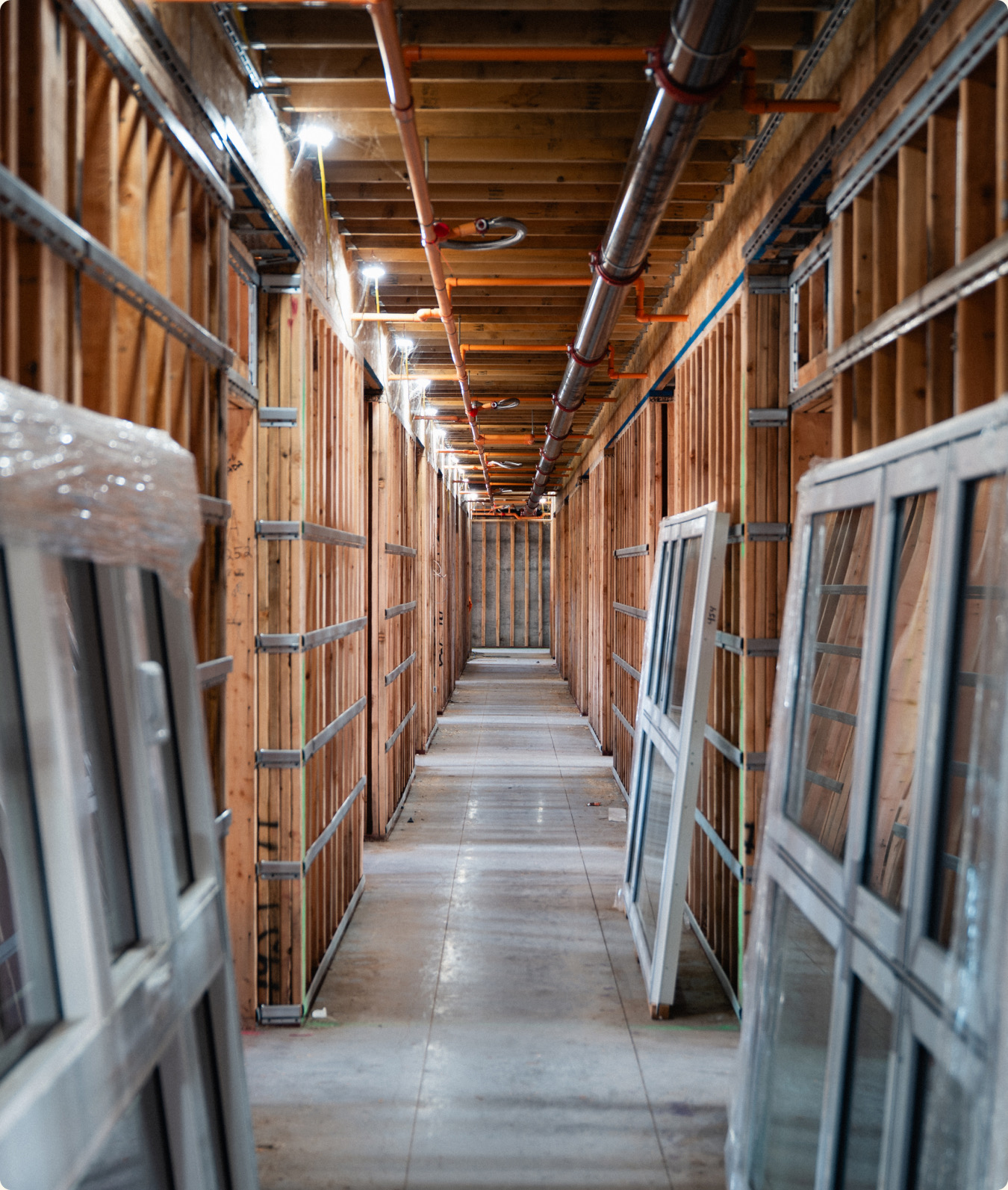 Wood-framed interior corridor during Residences at Eastbank construction.