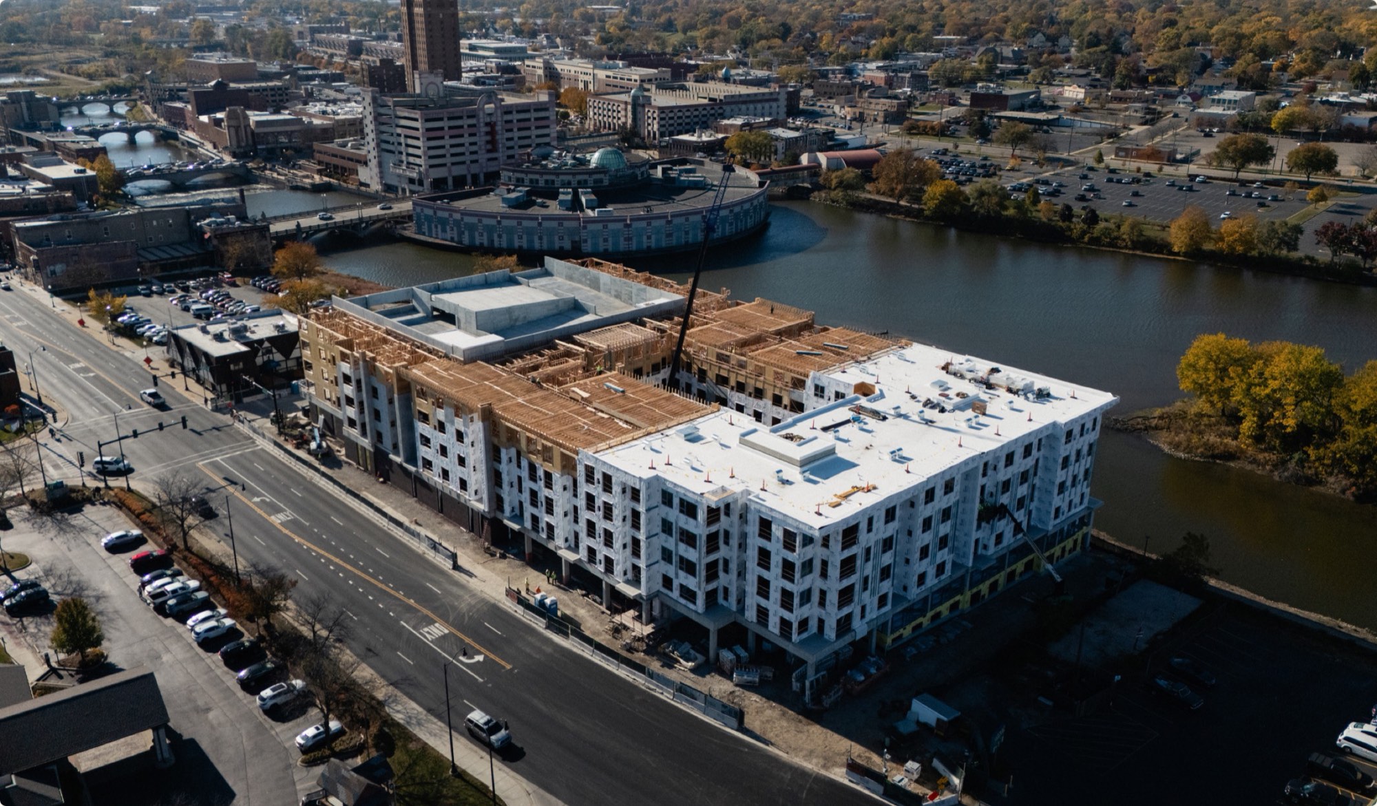 Aerial view of the completed Residences at Eastbank beside downtown Aurora.