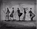 Black and white photo of five flamenco dancers in dynamic poses wearing traditional dresses.