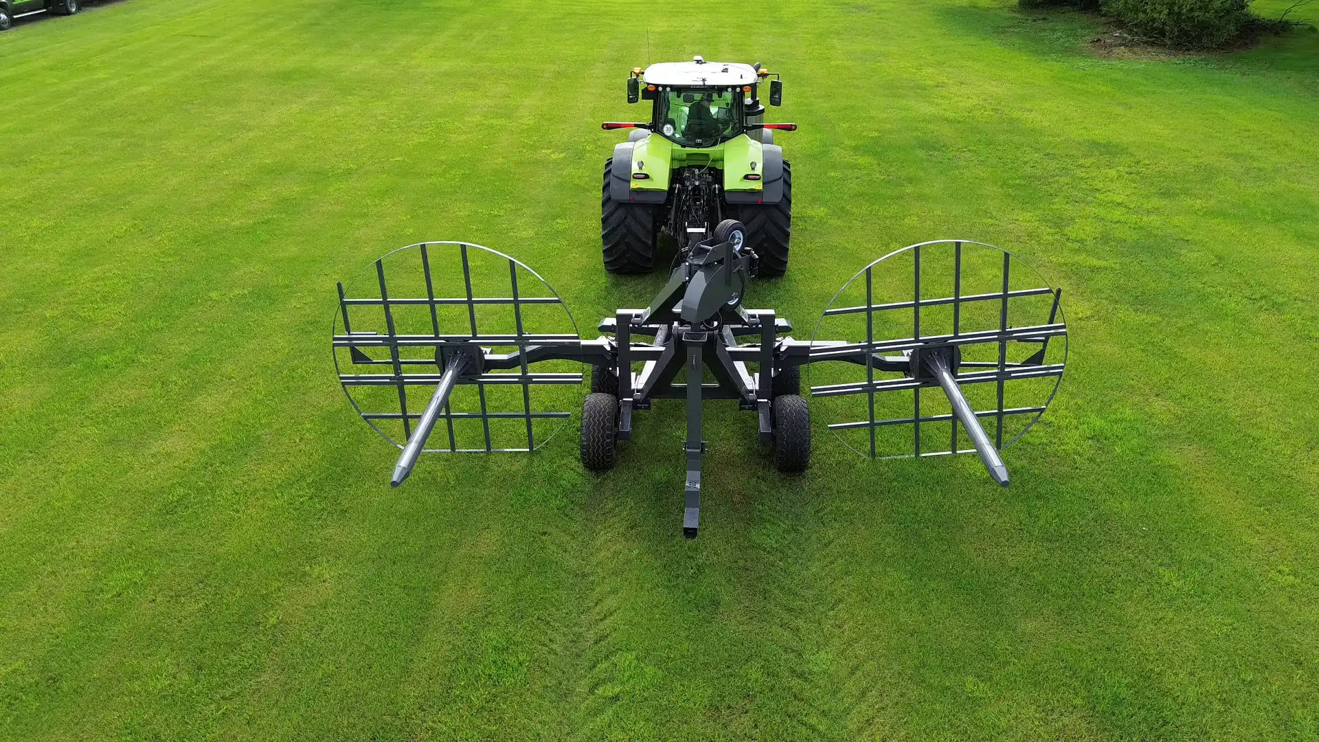 Rear perspective view of an empty 60 Caliber tile plow with its stringer tables folded up, showing the exposed steel frame, heavy-duty walking axles, and the main installation boot assembly.