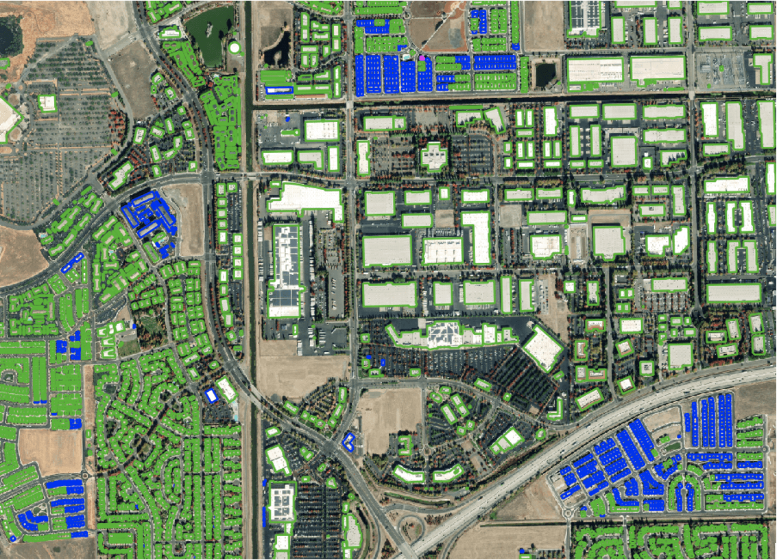 Figure 7. A visual comparing Ecopia's building footprints of the US from 2020 to 2021; green represents no change, blue represents new construction, and pink represents building modification