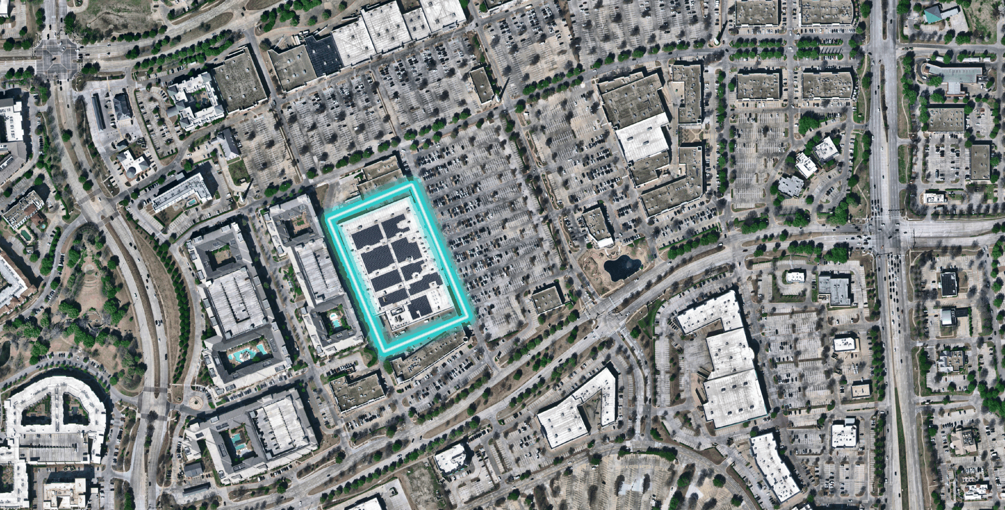 An example of AI object detection capabilities identifying buildings with solar panels in Frisco, Texas.
