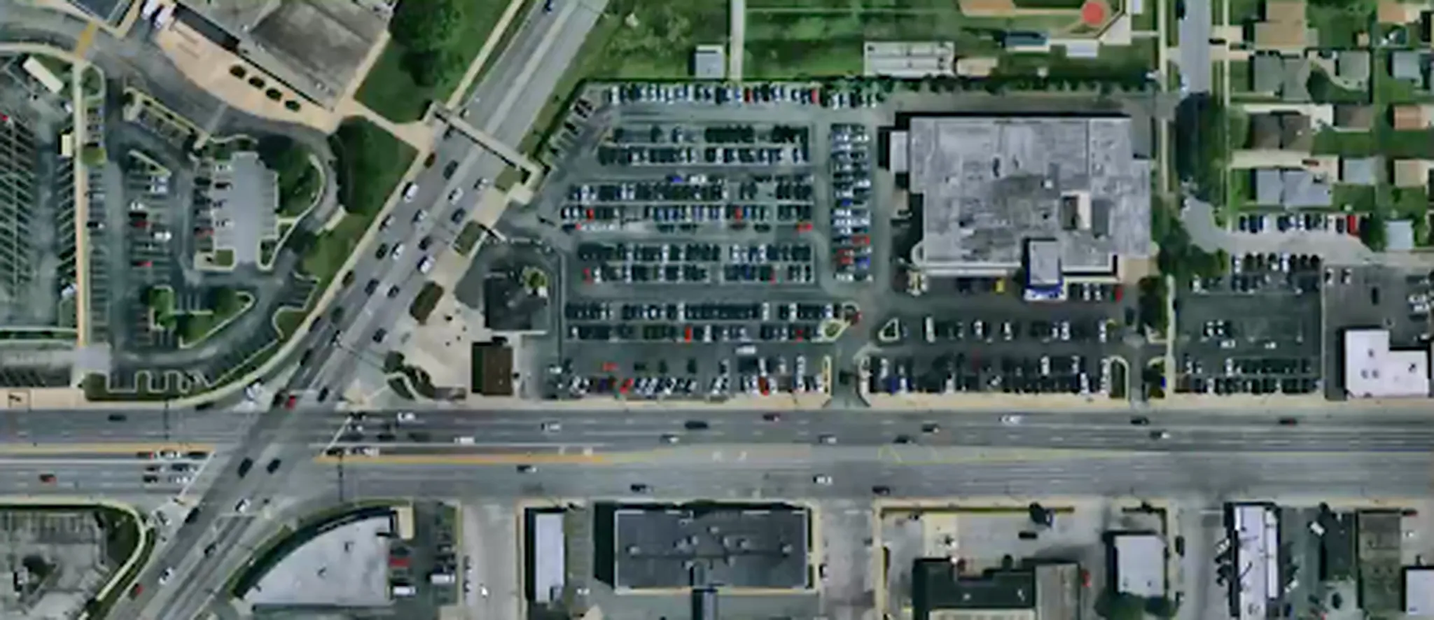 Aerial imagery of a commercial corridor with Ecopia vector features aligned to the underlying Eagleview imagery