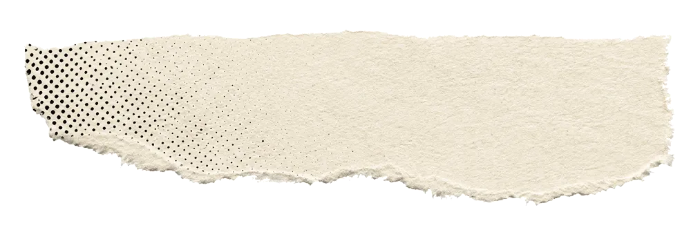 Torn strip of textured beige paper with rough edges and a pattern of black dots concentrated on the left side.
