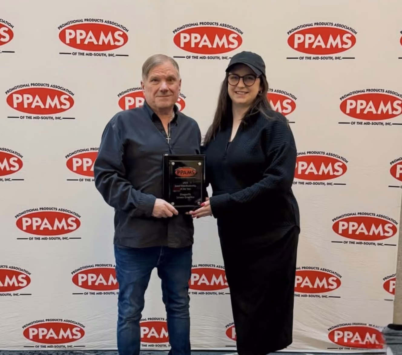 David Hackett and Lauren Durham accepting distributor award