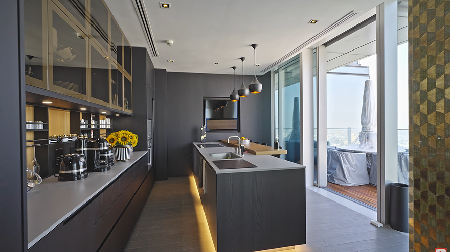 European-style kitchen with Gaggenau appliances and Bangkok city view inside Ritz-Carlton Residences