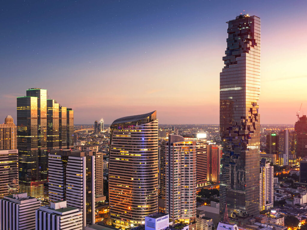 The Ritz-Carlton Residences at MahaNakhon at sunset, its stepped facade above the Sathorn skyline