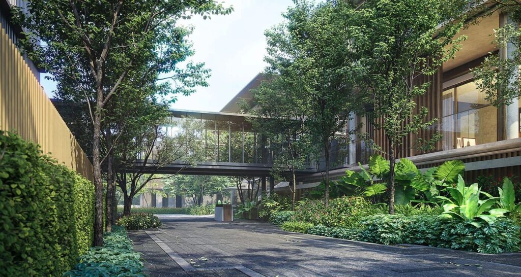 A landscaped driveway and covered walkway leading into the Mulberry Grove villas