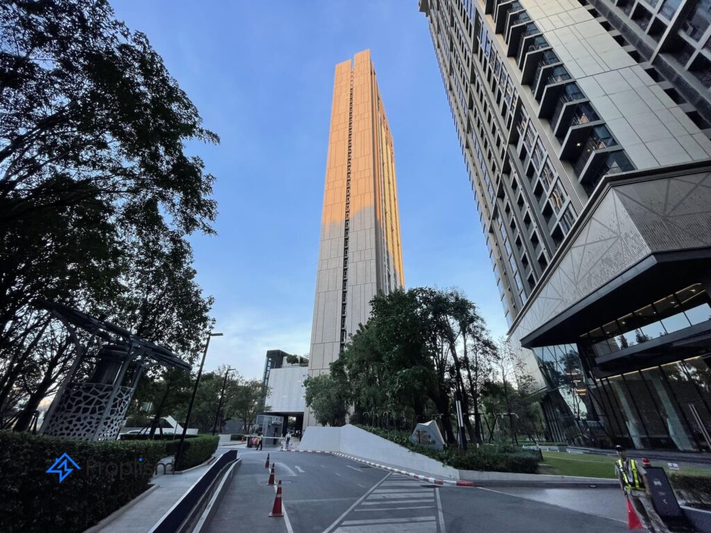 The Whizdom Connect tower at BTS Punnawithi seen from a landscaped plaza