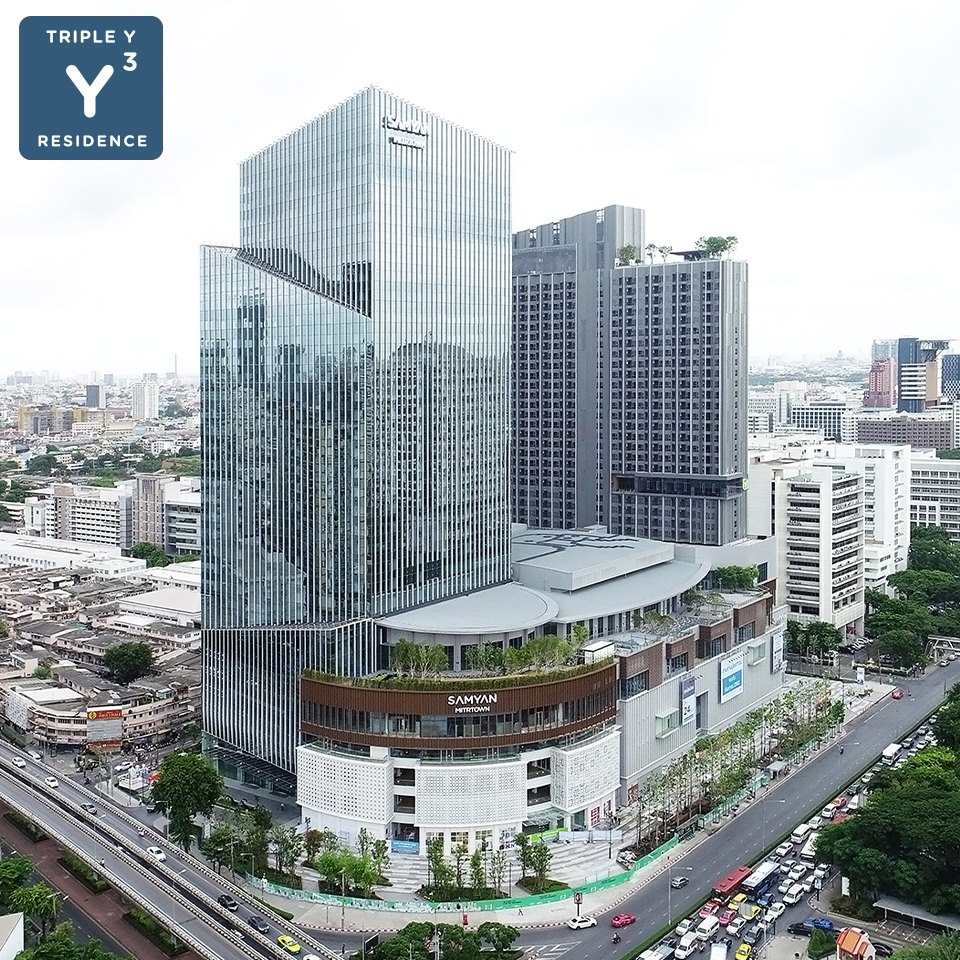 An aerial render of Triple Y Residence at Samyan, showing its podium and MRT connection