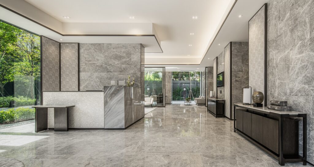 The marble lobby and reception desk at Tonson One Residence