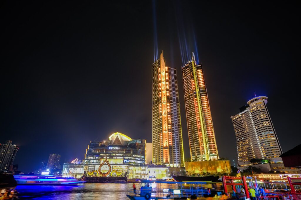 IconSiam and the riverside towers lit at night, seen across the Chao Phraya