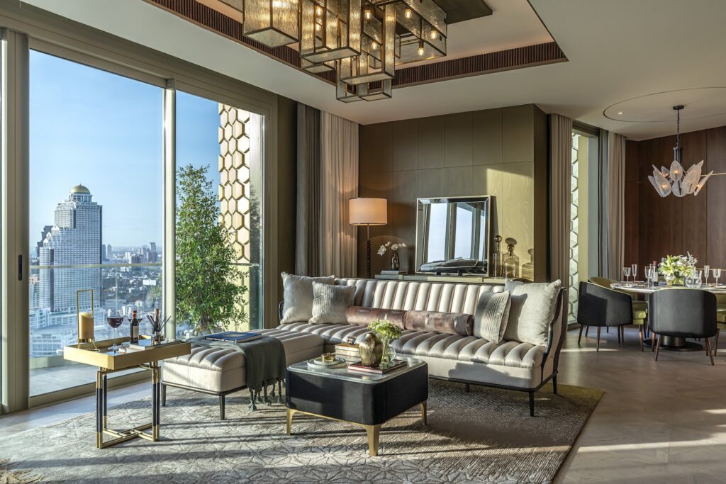 A sitting room at The Residences at Mandarin Oriental, with a patterned screen and river outlook