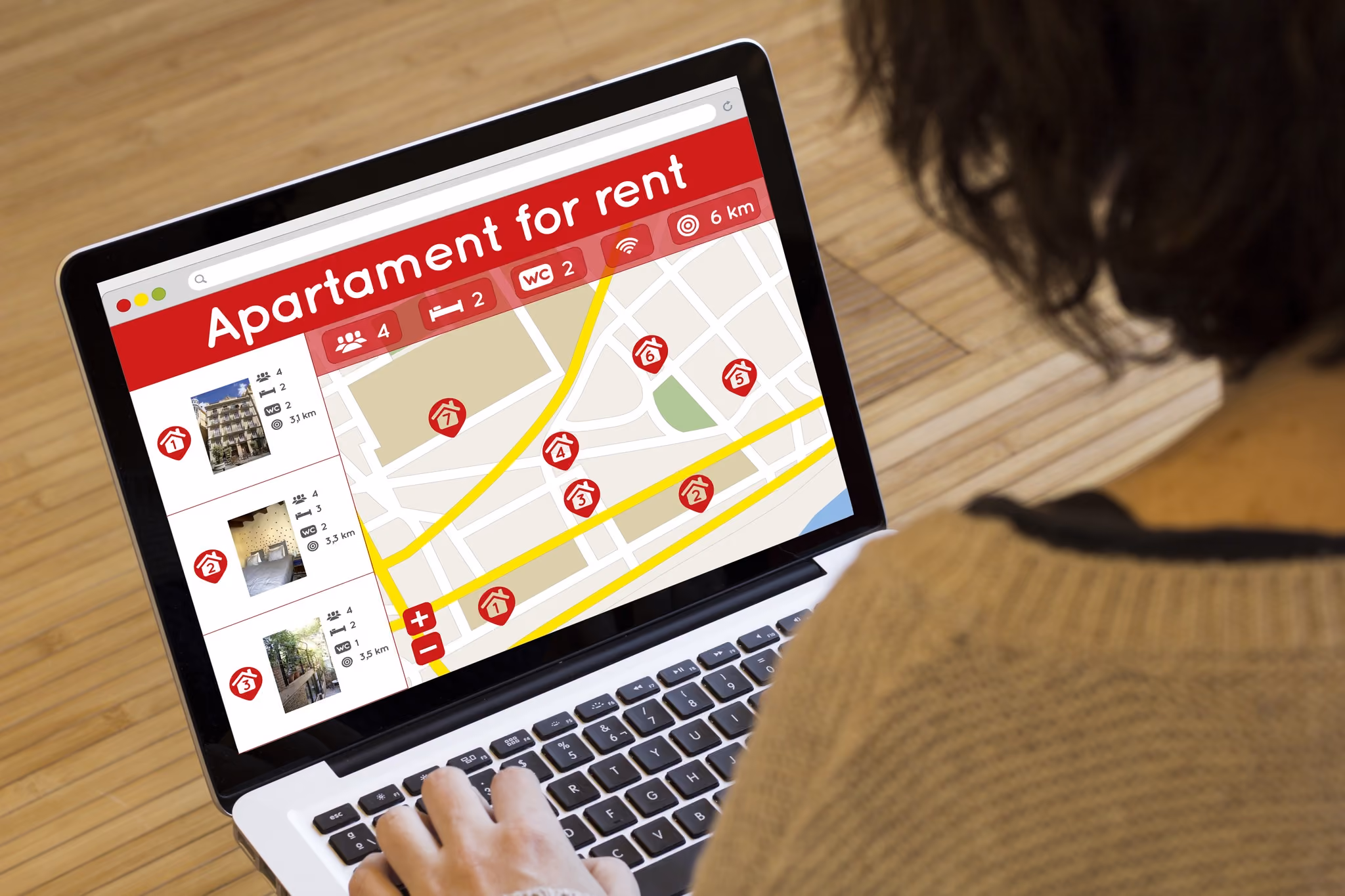 Person browsing an apartment for rent listing and map on a laptop screen