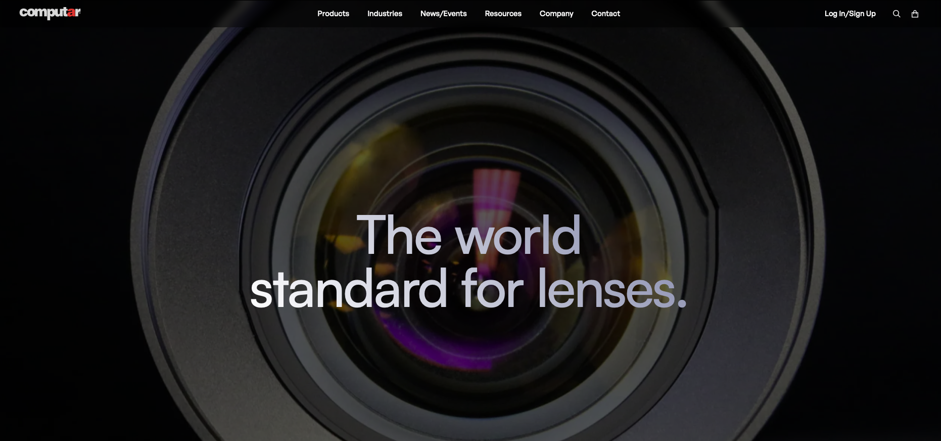 Close-up of a camera lens with the text 'The world standard for lenses' overlaid.