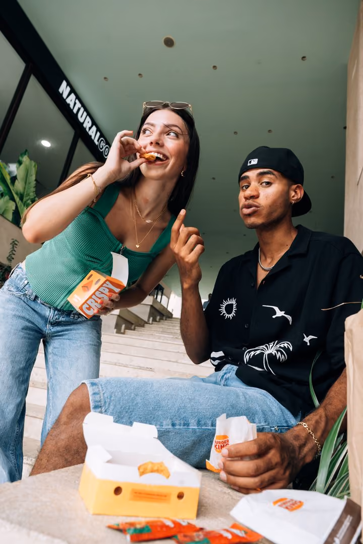 Students sharing takeaway food together