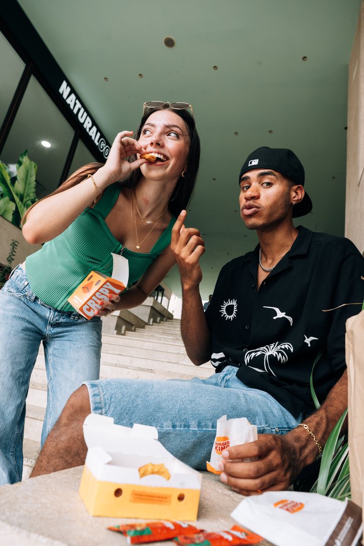 Students sharing takeaway food together