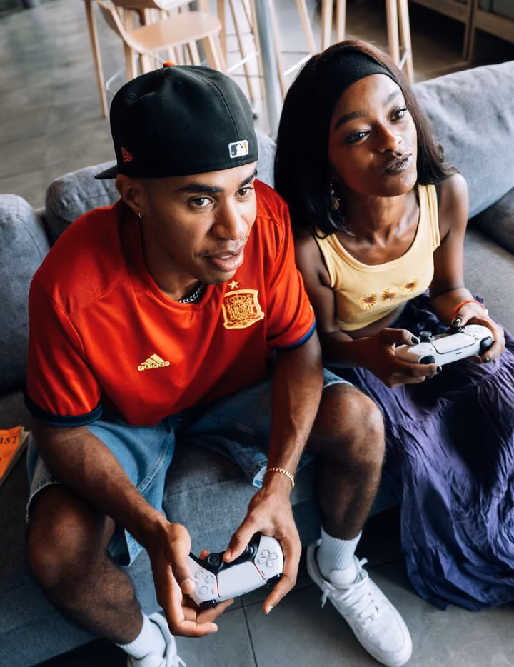 Two students playing video games together