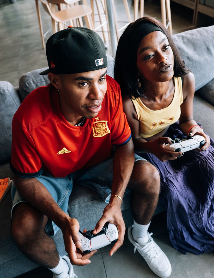 Two students playing video games together